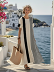 FJØRNA summer maxi dress for women featuring a striped pattern, short sleeves, and a lightweight wrap design.