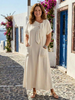 FJØRNA women's summer maxi dress with short sleeves and wrap style, flowing fabric, and floral print for warm-weather wear.