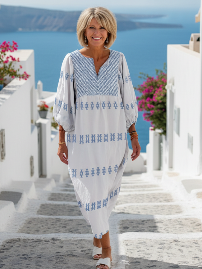 FJØRNA women's summer maxi dress with V-neck and long sleeves, flowing lightweight fabric, elegant and comfortable for warm weather.
