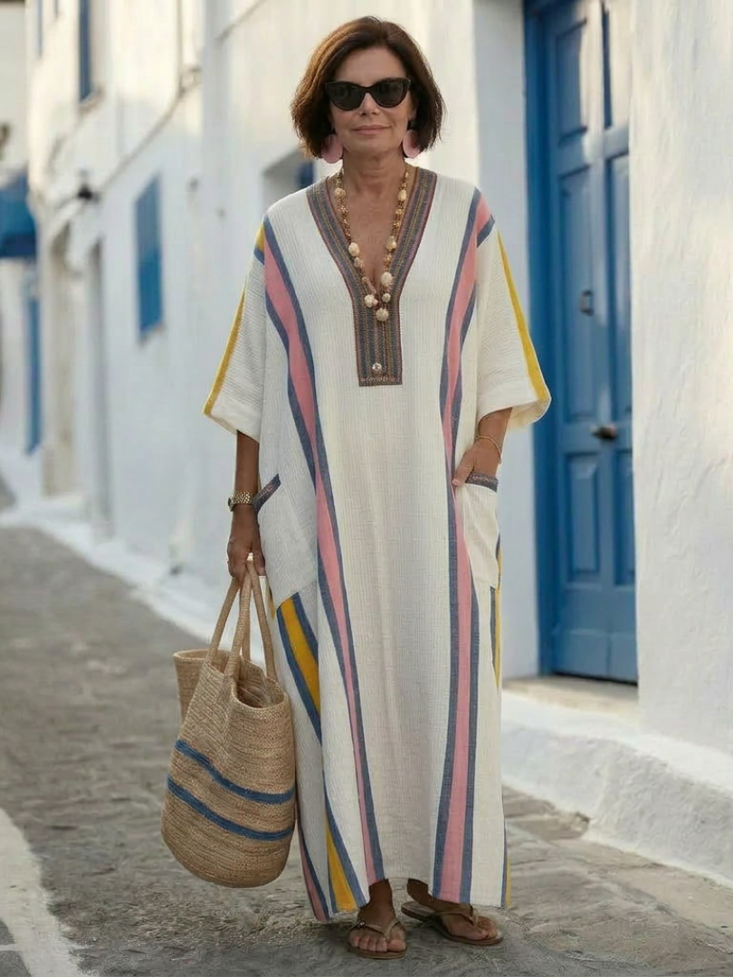 FJØRNA summer maxi dress for women with V-neck and short sleeves, flowing fabric, perfect for warm weather and casual outings.