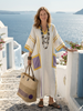 Flowy summer maxi dress for women by FJØRNA with short sleeves and pockets, shown in a lightweight, breezy fabric.