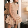FJØRNA tulle back bow dress featuring a delicate bow and flowing fabric, perfect for elegant occasions and stylish wear.