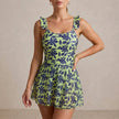 Turquoise ruffle floral summer swimsuit for women, stylish FJØRNA swimwear perfect for beach and pool days.