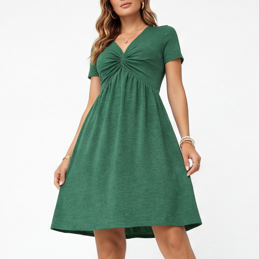 Women's comfortable cotton summer dress with V-neck and casual fit by FJØRNA, showcasing a relaxed, stylish dress design.