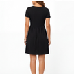 FJØRNA women's cotton summer dress with V-neck, casual fit, lightweight fabric, and short sleeves for comfortable warm weather wear.