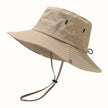 Unisex lightweight FJØRNA wide brim sun hat with adjustable cord and sun protection, perfect for outdoor wear.