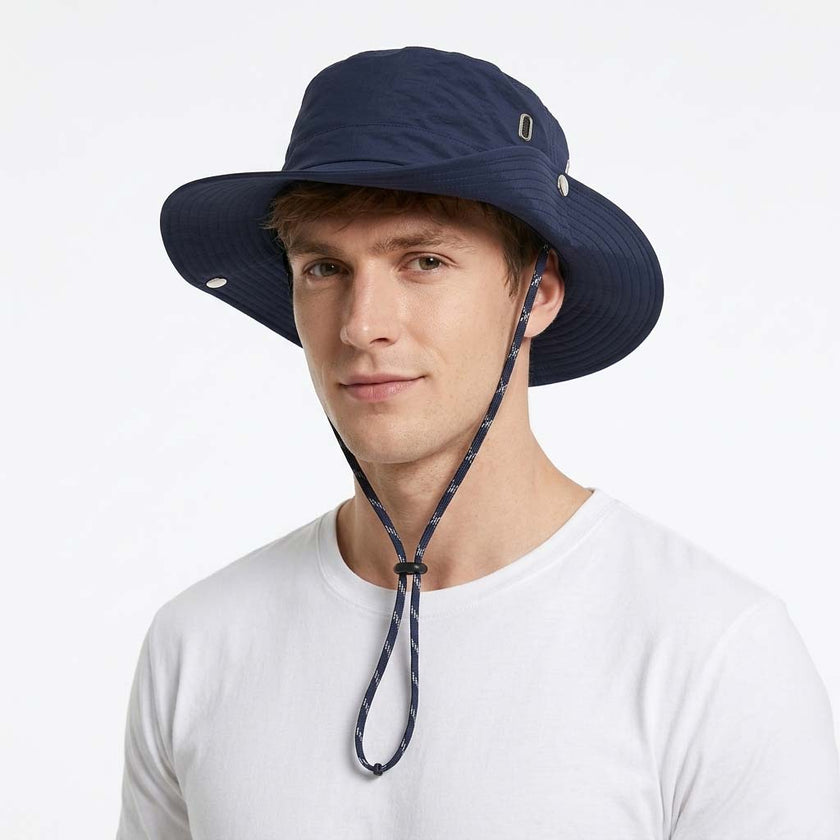 Unisex lightweight FJØRNA wide brim sun hat with adjustable cord, offering sun protection and comfortable fit.