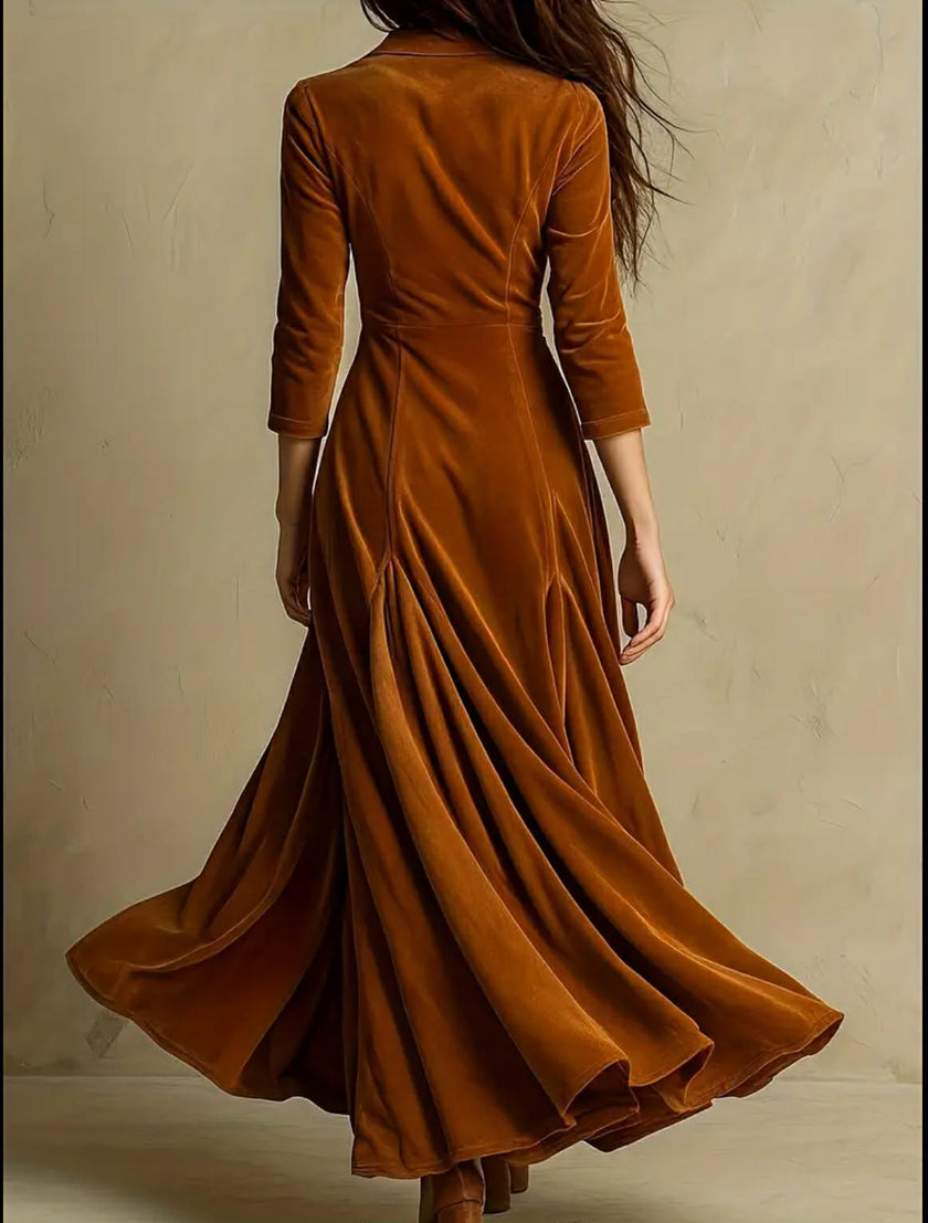 FJØRNA Selina elegant white velvet maxi dress displayed on a hanger, showcasing its flowing fabric and sophisticated design.