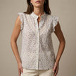 FJØRNA women's floral sleeveless summer blouse displayed untucked, lightweight and stylish for warm weather.