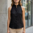 FJØRNA women's sleeveless denim summer blouse, untucked, showcasing casual sleeveless top for warm weather.