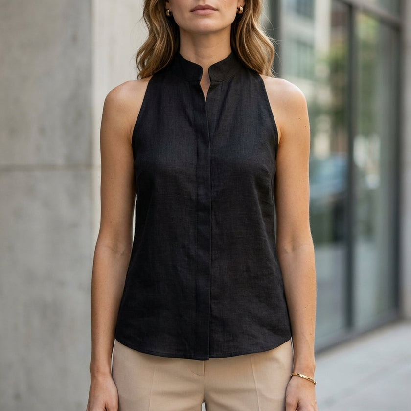 FJØRNA women's sleeveless denim summer blouse, untucked, showcasing casual sleeveless top for warm weather.