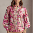 FJØRNA women's summer floral blouse with long sleeves and ruffle detailing, untucked, casual and stylish women's top.