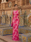Elegant floral sleeveless maxi dress for women by FJØRNA, showcasing a flowing design and vibrant pattern.