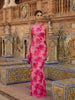 Elegant floral sleeveless maxi dress for women by FJØRNA, showcasing a flowing design and vibrant pattern.
