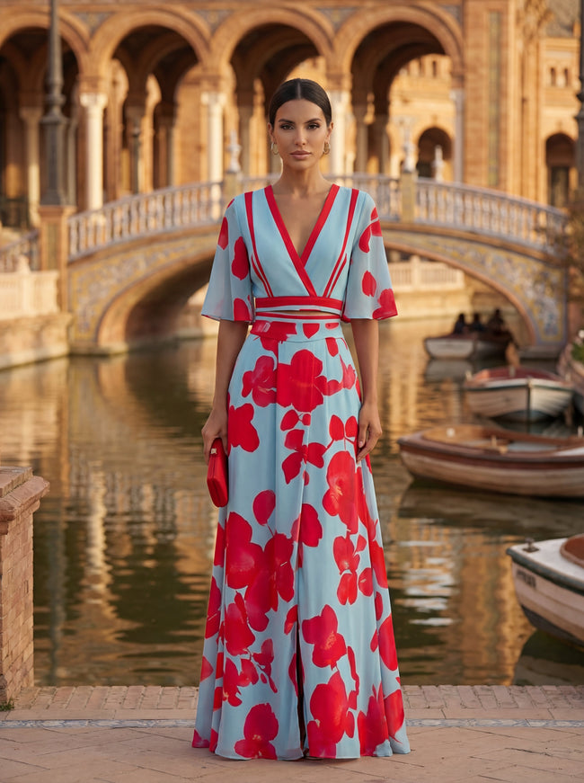 Woman wearing a floral V-neck elegant dress by FJØRNA, showcasing a stylish women’s dress with a flowy design.