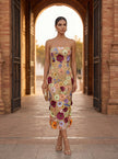 FJØRNA elegant floral strapless midi dress for women, showcased on a woman with a flowing silhouette and vibrant floral pattern.