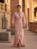 Woman wearing an elegant V-neck linen maxi dress by FJØRNA, flowing and stylish for summer or casual occasions.