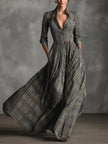White tartan linen maxi dress with flared A-line skirt by FJØRNA, shown with flowing fabric and elegant design details.