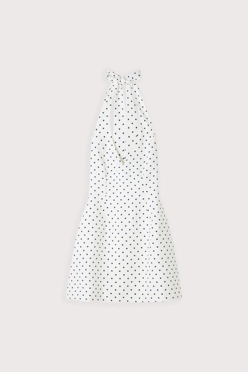 White polka dot mini dress by FJØRNA featuring a voluminous skirt, perfect for party and daytime wear.