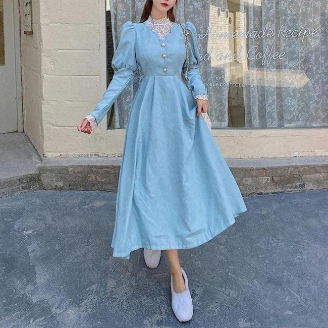 White vintage balloon sleeve maxi dress by FJØRNA, featuring a flowy silhouette and elegant design.
