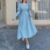 White vintage balloon sleeve maxi dress by FJØRNA, featuring a flowy silhouette and elegant design.