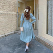 White vintage balloon sleeve maxi dress by FJØRNA, flowing silhouette and elegant design perfect for stylish occasions.