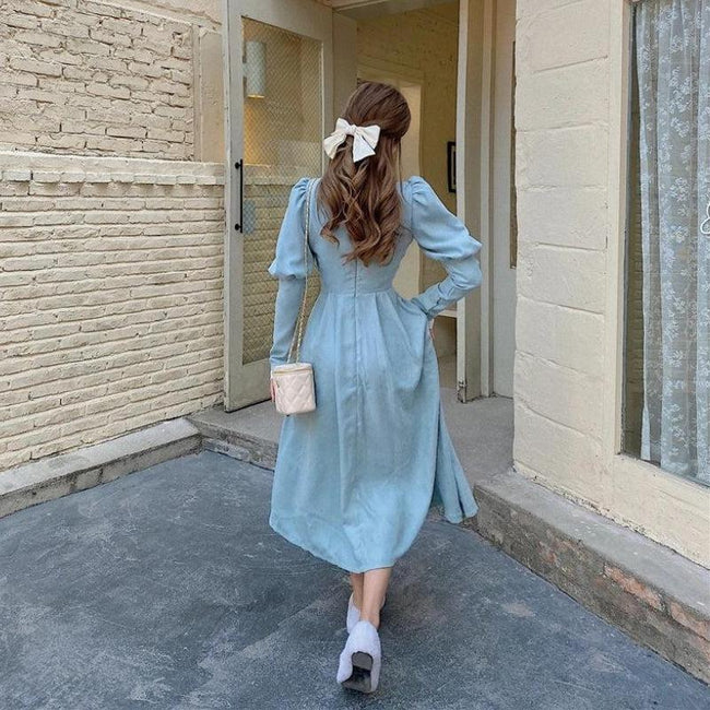 White vintage balloon sleeve maxi dress by FJØRNA, flowing silhouette and elegant design perfect for stylish occasions.