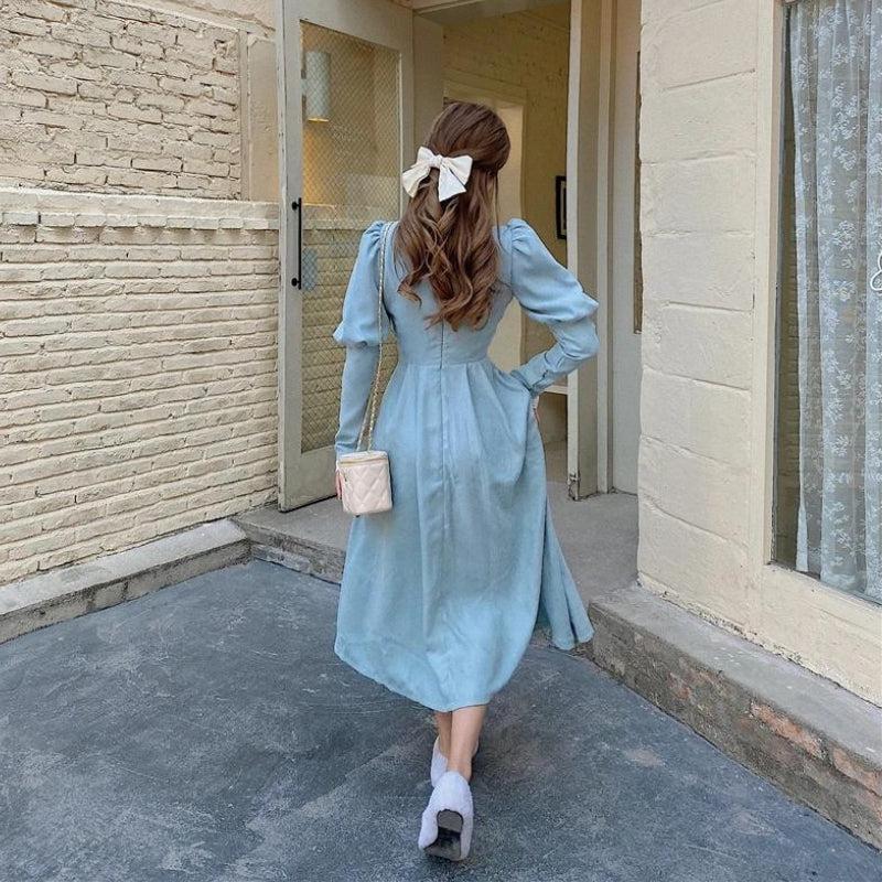 White vintage balloon sleeve maxi dress by FJØRNA, flowing silhouette and elegant design perfect for stylish occasions.