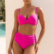 Warm pink FJØRNA ruched twist-front bikini set for women with tummy control, featuring a stylish and flattering design.