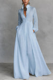 FJØRNA white long sleeve maxi dress with stand collar and button details, elegant and flowing for formal or casual wear.