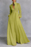 White FJØRNA maxi dress with stand collar, button front, long sleeves, and flowing silhouette, perfect for elegant occasions.
