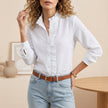 White seersucker blouse for women by FJØRNA featuring ruffle trim and textured summer fabric.