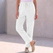 White linen summer trousers for women with drawstring waist by FJØRNA, casual and breathable women's clothing.