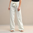 White women's summer trousers by FJØRNA featuring high waist and cotton fabric, perfect for casual warm-weather wear.