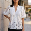 White FJØRNA women's summer blouse with v-neck, linen fabric, button front, casual style, perfect for warm weather.