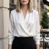 White women's satin summer blouse with V-neck and long sleeves, casual style by FJØRNA.