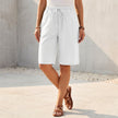White women's summer shorts by FJØRNA with cotton fabric and drawstring waist, perfect for casual warm-weather wear.
