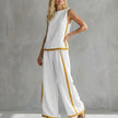 White women's summer two-piece co-ord set with slit details, stylish and comfortable for warm weather from FJØRNA.