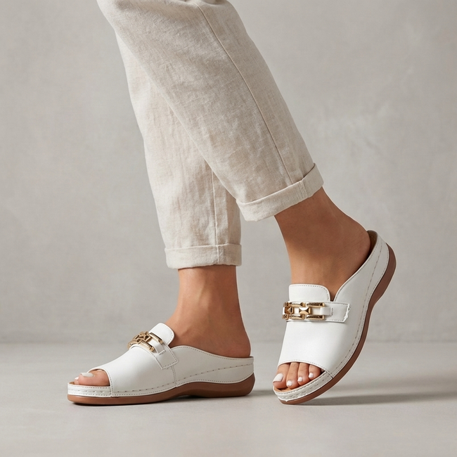 White FJØRNA orthopedic peep-toe chain link wedge sandals for women with supportive design and stylish open-toe style.