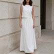 White sleeveless crop top and maxi skirt set by FJØRNA, featuring a stylish elegant design perfect for summer occasions.