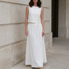 White sleeveless crop top and maxi skirt set by FJØRNA, featuring a stylish elegant design perfect for summer occasions.