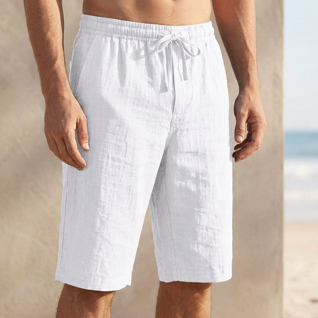 Men's white casual knee-length chino shorts with adjustable drawstring waist, designed for comfort and vacation style by FJØRNA.