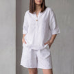 FJØRNA oversized woven two-piece set with white V-neck shirt and high-waist shorts, casual and stylish summer outfit