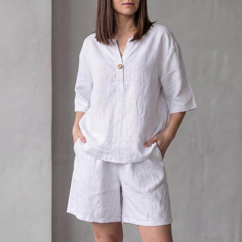 FJØRNA oversized woven two-piece set with white V-neck shirt and high-waist shorts, casual and stylish summer outfit