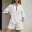 White FJØRNA relaxed v-neck blouse and tailored short set, stylish 2-piece outfit with comfortable fit and modern design.