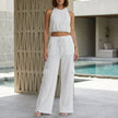 White FJØRNA halter top and wide-leg lounge set, stylish 2-piece ensemble with relaxed fit and comfortable fabric.