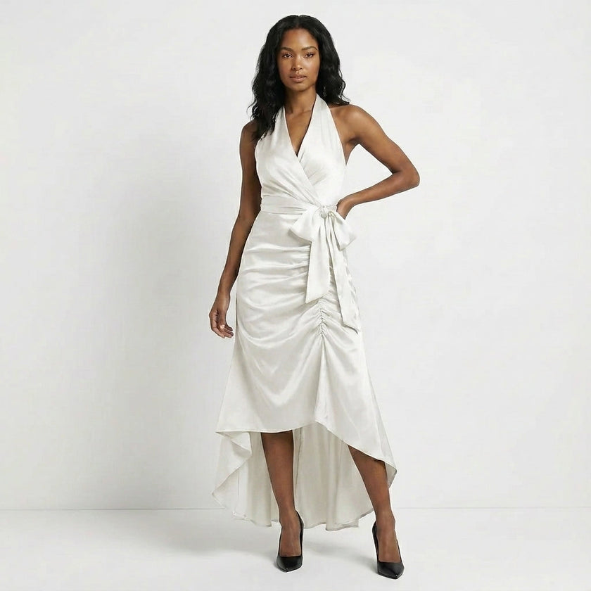 FJØRNA satin halter neck wrap maxi dress with bow tie waist and ruffled hem, white color, elegant evening dress.