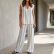 FJØRNA minimalist striped sleeveless top and wide-leg pant set in white, stylish 2-piece outfit for casual wear.