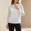 White fitted sheer lace blouse with ruffled tie-neck and floral detailing, women's FJØRNA top featuring elegant design.