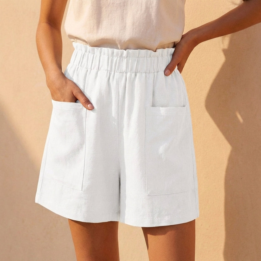 White women's linen summer shorts with pockets, casual fit, featuring a relaxed style by FJØRNA.